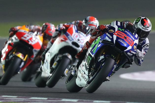 Spanish rider Jorge Lorenzo (front) of Movistar Yamaha MotoGP competes during the MotoGP race of the Qatar Grand Prix on March 20, 2016 at the Losail International Circuit in the Qatari capital Doha.  / AFP / KARIM JAAFAR        (Photo credit should read KARIM JAAFAR/AFP/Getty Images)