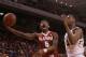 Alabama guard Justin Coleman (5) shoots as Auburn center Trayvon Reed (4) guards during the first half during an NCAA college basketball game Tuesday, Feb. 17, 2015, in Auburn, Ala. (AP Photo/Brynn Anderson)