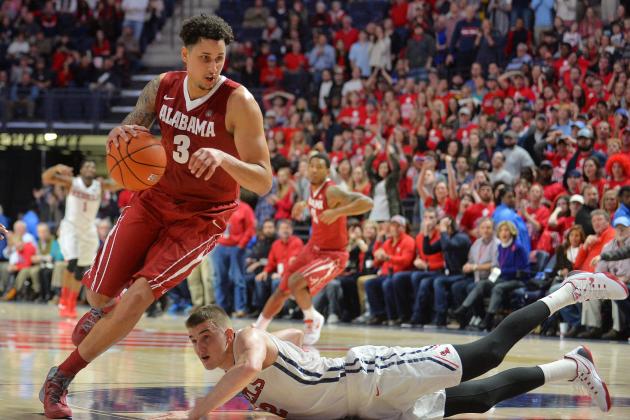 Alabama forward Michael Kessens (3) drives the ball past Mississippi forward Tomasz Gielo (12) during the second half of an NCAA college basketball game in Oxford, Miss., Thursday, Jan. 7, 2016. Mississippi won 74-66. (AP Photo/Thomas Graning)