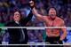 Paul Heyman, left, celebrates with Brock Lesnar after his win over the Undertaker during Wrestlemania XXX at the Mercedes-Benz Super Dome in New Orleans on Sunday, April 6, 2014. (Jonathan Bachman/AP Images for WWE)