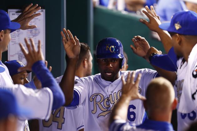 KANSAS CITY, MO - APRIL 03: Lorenzo Cain #6 of the Kansas City Royals is congratulated by teammates in the dugout after scoring during the 6th inning of the opening day game against the New York Mets at Kauffman Stadium on April 3, 2016 in Kansas City, Missouri. (Photo by Jamie Squire/Getty Images)