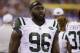 FILE - In this Saturday, Aug. 29, 2015 file photo, New York Jets defensive end Muhammad Wilkerson (96) walks the sidelines during the second half of a preseason NFL football game against the New York Giants in East Rutherford, N.J. Muhammad Wilkerson was 10 when his mother had breast cancer. Wilkerson honored 96 _ the number of his jersey _ breast cancer survivors at a three-course luncheon Tuesday, Oct. 13, 2015 at Central Park restaurant not far from where he grew up. October is the NFL's Breast Cancer Awareness month. (AP Photo/Seth Wenig)