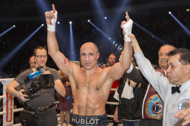 German boxer Arthur Abraham celebrates after he defeated England's Martin Murray in a WBO super middleweight world championship fight at the Tui Arena in Hannover, Germany, Saturday, Nov. 21, 2015.  Abraham retained his WBO super middleweight belt with a split decision win over Murray on Saturday night. (AP Photo/Joerg Sarbach)