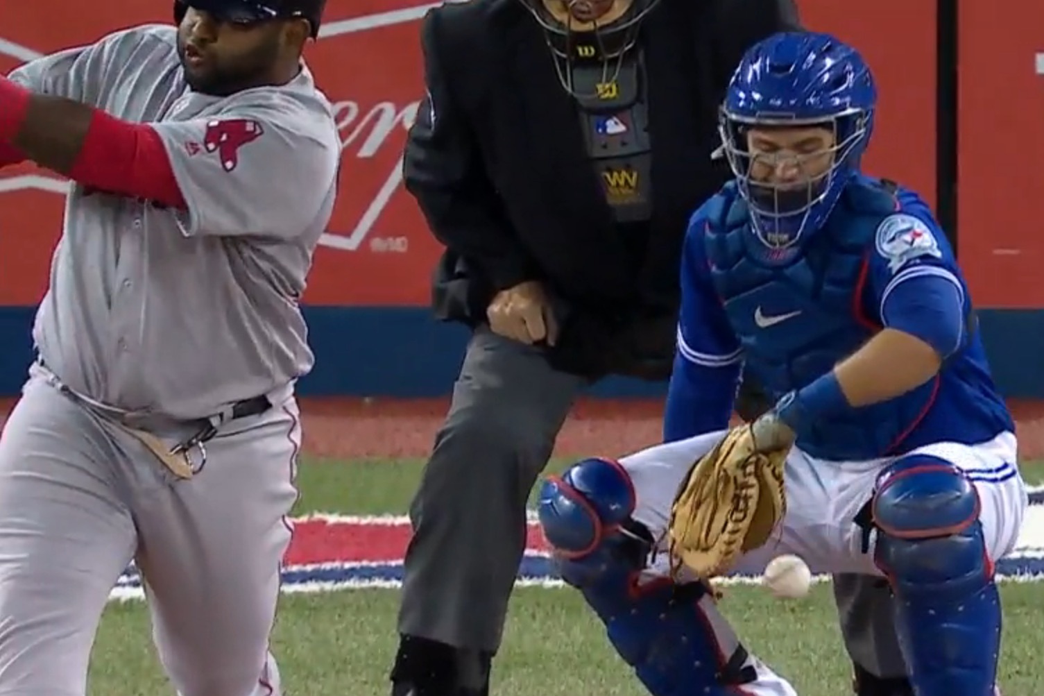 Boston Red Sox's Pablo Sandoval blows a bubble during the ninth