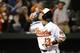 Baltimore Orioles' Manny Machado gestures as he rounds the bases after hitting a solo home run in the sixth inning of a baseball game against the Minnesota Twins in Baltimore, Thursday, April 7, 2016. (AP Photo/Patrick Semansky)