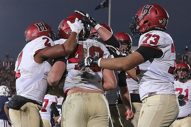 NEW HAVEN, CT - NOVEMBER 21: Ben Braunecker #48 of the Harvard Crimson celebrates with teammates after his touchdown in the second half against the Yale Bulldogs on November 21, 2015 in New Haven, Connecticut. (Photo by Jim Rogash/Getty Images)
