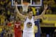 Golden State Warriors' Stephen Curry (30) celebrates after scoring against the Houston Rockets during the first half in Game 1 of a first-round NBA basketball playoff series Saturday, April 16, 2016, in Oakland, Calif. (AP Photo/Marcio Jose Sanchez)