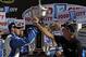 Carl Edwards, left, celebrates with Steve Smith, the president and CEO of Food City, after winning a NASCAR Sprint Cup Series auto race, Sunday, April 17, 2016, in Bristol, Tenn. (AP Photo/Wade Payne)