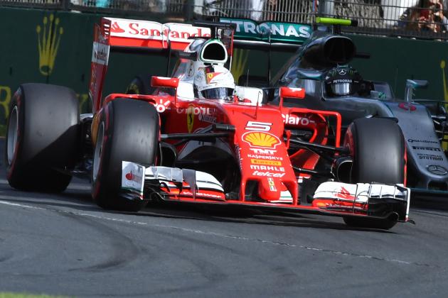 Ferrari's German driver Sebastian Vettel (L) powers through a corner ahead of Mercedes AMG Petronas F1 Team's German driver Nico Rosberg (R) during the Formula One Australian Grand Prix in Melbourne on March 20, 2016. / AFP / Paul Crock / IMAGE RESTRICTED TO EDITORIAL USE - STRICTLY NO COMMERCIAL USE (Photo credit should read PAUL CROCK/AFP/Getty Images)