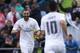 GETAFE, SPAIN - APRIL 16: Karim Benzema (L) of Real Madrid CF celebrates scoring their opening goal with teammate James Rodriguez (R) during the La Liga match between Getafe CF and Real Madrid CF at Coliseum Alfonso Perez on April 16, 2016 in Getafe, Spain. (Photo by Gonzalo Arroyo Moreno/Getty Images)
