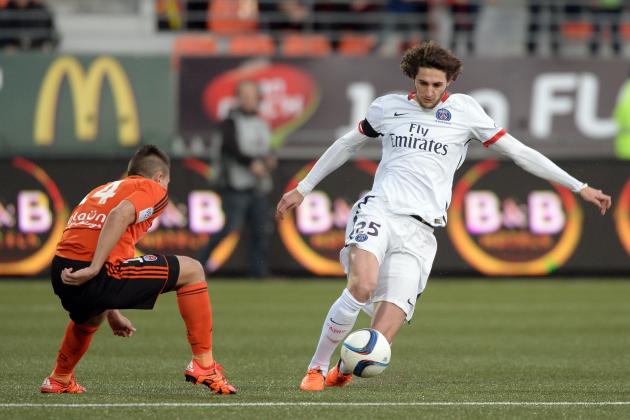 Lorient's French Portuguese defender Raphael Guerreiro (L) vies with Paris Saint-Germain's French midfielder Adrien Rabiot during the French L1 football match between Lorient and Paris Saint-Germain on November 21, 2015 at the Moustoir stadium in Lorient, western France. AFP PHOTO / JEAN-SEBASTIEN EVRARD        (Photo credit should read JEAN-SEBASTIEN EVRARD/AFP/Getty Images)