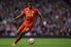 Liverpool's Belgian striker Divock Origi controls the ball during the English Premier League football match between Liverpool and Everton at Anfield in Liverpool, north west England on April 20, 2016. / AFP / PAUL ELLIS / RESTRICTED TO EDITORIAL USE. No use with unauthorized audio, video, data, fixture lists, club/league logos or 'live' services. Online in-match use limited to 75 images, no video emulation. No use in betting, games or single club/league/player publications. / (Photo credit should read PAUL ELLIS/AFP/Getty Images)