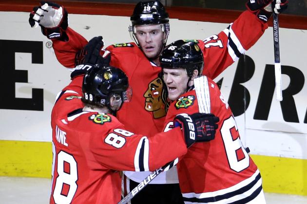 Chicago Blackhawks right wing Andrew Shaw, right, celebrates with right wing Patrick Kane, left, and center Jonathan Toews after scoring a goal against the St. Louis Blues during the third period in Game 6 of an NHL hockey first-round Stanley Cup playoff series Saturday, April 23, 2016, in Chicago. (AP Photo/Nam Y. Huh)