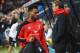NEWCASTLE UPON TYNE, ENGLAND - DECEMBER 06: Substitute Daniel Sturridge of Liverpool walks to the bench past Jurgen Klopp manager of Liverpool prior to the Barclays Premier League match between Newcastle United and Liverpool at St James' Park on December 6, 2015 in Newcastle upon Tyne, England (Photo by Michael Regan/Getty Images)
