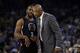 Los Angeles Clippers coach Doc Rivers, right, talks to guard Chris Paul (3) during the first half of an NBA basketball game against the Golden State Warriors on Wednesday, March 23, 2016, in Oakland, Calif. (AP Photo/Marcio Jose Sanchez)