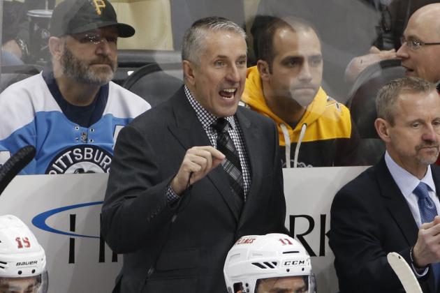 Calgary Flames head coach Bob Hartley gives instructions during an NHL hockey game against the Pittsburgh Penguins in Pittsburgh, Saturday, March 5, 2016. (AP Photo/Gene J. Puskar)