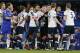 Referee Mark Clattenburg talks with Chelsea and Tottenham players during the English Premier League soccer match between Chelsea and Tottenham Hotspur at Stamford Bridge stadium in London, Monday, May 2, 2016. (AP Photo/Frank Augstein)