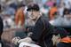 FILE - This July 28, 2015 file photo shows San Francisco Giants pitcher Tim Lincecum looking on during a baseball game against the Milwaukee Brewers in San Francisco. The two-time NL Cy Young Award winner will pitch for major league clubs in a showcase event Friday, May 6, 2016 as he attempts to make a comeback bid from hip surgery last year. (AP Photo/Jeff Chiu, file)