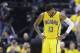 Indiana Pacers forward Paul George walks downcourt during a free-throw attempt by the Toronto Raptors during the first half of Game 3 of an NBA first-round playoff basketball series in Indianapolis, Thursday, April 21, 2016. (AP Photo/Michael Conroy)