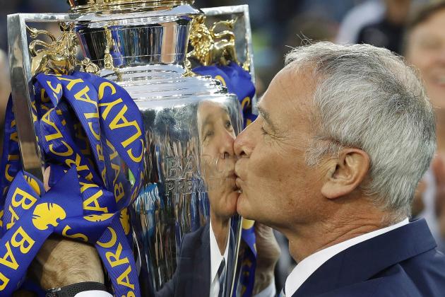 Leicester’s team manager Claudio Ranieri kisses the trophy as Leicester City celebrate becoming the English Premier League soccer champions at King Power stadium in Leicester, England, Saturday, May 7, 2016.(AP Photo/Matt Dunham)