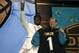 Dante Fowler, left, stands with NFL commissioner Roger Goodell, right, on stage after being drafted third by Jacksonville in the first round of the 2015 NFL Draft, Thursday, April 30, 2015, in Chicago. (Jeff Haynes/AP Images for Panini)