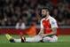 Arsenal's Olivier Giroud sits on the pitch after a chance to score during the English Premier League soccer match between Arsenal and West Bromwich Albion at the Emirates Stadium in London, Thursday, April 21, 2016. (AP Photo/Matt Dunham)