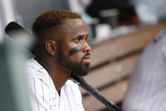 FILE - In this Aug. 16, 2015, file photo, Colorado Rockies shortstop Jose Reyes watches from dugout during the seventh inning of a baseball game against the San Diego Padres in Denver. Colorado’s Jose Reyes has been suspended by Major League Baseball through May 31 for violating MLB’s domestic violence policy.  The unpaid suspension of Reyes is retroactive to February 23, 2016, when Reyes was placed on leave pending the resolution of criminal proceedings in Hawaii.  Reyes has agreed not to appeal the discipline.  (AP Photo/David Zalubowski, File)