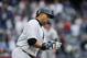 New York Yankees designated hitter Carlos Beltran applauds his 400th career home run as he trots down the first base line during the sixth inning of a baseball game against the Chicago White Sox in New York, Sunday, May 15, 2016. (AP Photo/Kathy Willens)