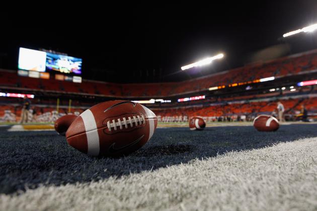 MIAMI GARDENS, FL - JANUARY 04:  A detail of a Nike official NCAA size football as it sits in the end zone while the West Virginia Mountaineers stretchon the field prior to playing against the Clemson Tigers during the Discover Orange Bowl at Sun Life Stadium on January 4, 2012 in Miami Gardens, Florida.  (Photo by Streeter Lecka/Getty Images)