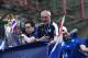 Leicester City's Italian manager Claudio Ranieri (C) gestures as he along with the club's football players and owners parade in an open-bus with the Premier League trophy through Bangkok on May 19, 2016.
Newly crowned English Premier League champions Leicester City received a royal seal of approval on May 19 at Bangkok's Grand Palace, with the Thai-owned team presenting its trophy to a portrait of the king before a bus parade through the capital. / AFP / CHRISTOPHE ARCHAMBAULT (Photo credit should read CHRISTOPHE ARCHAMBAULT/AFP/Getty Images)