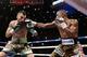 Erislandy Lara, right, fights Vanes Martirosyan in a super welterweight title fight, Saturday, May 21, 2016, in Las Vegas. (AP Photo/John Locher)
