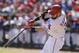 Texas Rangers' Josh Hamilton hits a solo home run during the seventh inning of a baseball game against the Los Angeles Angels in Arlington, Texas, Saturday, Oct. 3, 2015. (AP Photo/LM Otero)