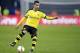 Dortmund's Henrikh Mkhitaryan plays the ball during the German Bundesliga soccer match between Hertha BSC Berlin and Borussia Dortmund in Berlin, Germany, Saturday, Feb. 6, 2016. (AP Photo/Michael Sohn)