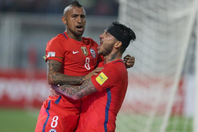 Chile's Arturo Vidal, left, celebrates after scoring against Venezuela  with his teammate Mauricio Pinilla during a 2018 World Cup qualifying soccer match in Barinas, Venezuela, Tuesday, March 29, 2016.(AP Photo/Fernando Llano)