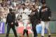 San Francisco Giants' Brandon Belt, second from left, walks off the field after being injured on a play at second base in the eighth inning of a baseball game against the San Diego Padres on Wednesday, May 25, 2016, in San Francisco. At right is Giants manager Bruce Bochy. (AP Photo/Eric Risberg)
