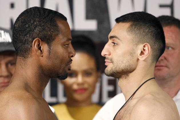 Boxers Shane Mosley, Sr., left, David Avanesyan, right, face off as they pose for photographers during a news conference Tuesday, May 24, 2016, in Glendale, Ariz., promoting the interim WBA welterweight title fight scheduled for Saturday. (AP Photo/Ross D. Franklin)