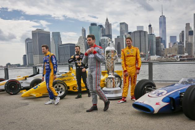 Drivers, from left, James Hinchcliffe, Marco Andretti, Ryan Hunter-Reay and Will Power step away after posing during a promotiona eventl with the with the Borg-Warner race trophy and iconic race cars, Tuesday, May 24, 2016, in New York. They will race for the trophy in Sunday's 100th running of the Indianapolis 500 auto race. (AP Photo/Bebeto Matthews)