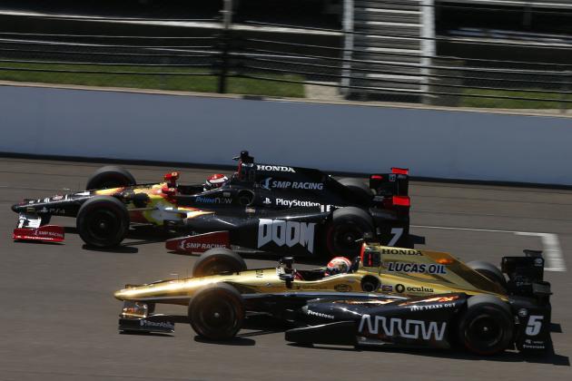 May 23, 2016; Indianapolis, IN, USA; Verizon Indy Car driver James Hinchcliffe (5) and Mikhail Aleshin (7) race side by side down the front straightaway during practice for the Indianapolis 500 at Indianapolis Motor Speedway. Mandatory Credit: Brian Spurlock-USA TODAY Sports