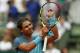 Spain's Rafael Nadal acknowledges cheering spectators after winning his second round match of the French Open tennis tournament against Argentina's Facundo Bagnis at the Roland Garros stadium in Paris, France, Thursday, May 26, 2016. (AP Photo/Alastair Grant)