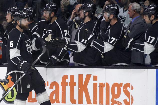 Los Angeles Kings defenseman Jake Muzzin, left, is congratulated by teammates after scoring against the Washington Capitals during the first period of an NHL hockey game in Los Angeles, Wednesday, March 9, 2016. (AP Photo/Alex Gallardo)