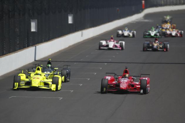 May 27, 2016; Indianapolis, IN, USA; Verizon Indy Car drivers Simon Pagenaud (22) and Graham Rahal (15) drive side by side down the front straightaway during Carb Day for the Indianapolis 500 at Indianapolis Motor Speedway. Mandatory Credit: Brian Spurlock-USA TODAY Sports