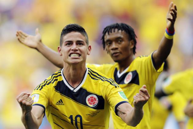 FILE - In this June 19, 2014, file photo, Colombia's James Rodriguez (10) celebrates with teammate Colombia's Juan Cuadrado after scoring his side's first goal during the group C World Cup soccer match between Colombia and Ivory Coast at the Estadio Nacional in Brasilia, Brazil. (AP Photo/Fernando Llano, File)