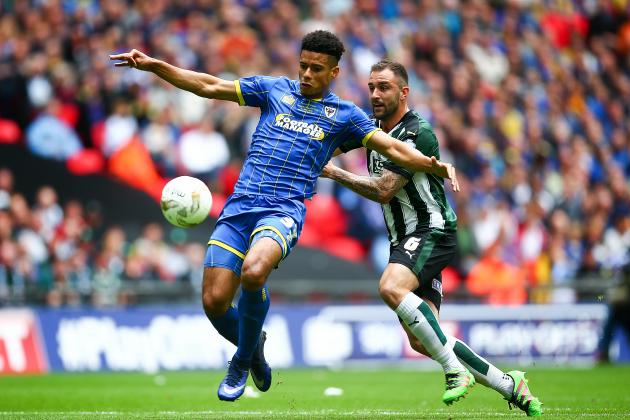 LONDON, ENGLAND - MAY 30: Lyle Taylor of Wimbledon tackles with Carl McHugh of Plymouth during the Sky Bet League Two Play Off Final match between Plymouth Argyle and AFC Wimbledon at Wembley Stadium on May 30, 2016 in London, England. (Photo by Jordan Mansfield/Getty Images)