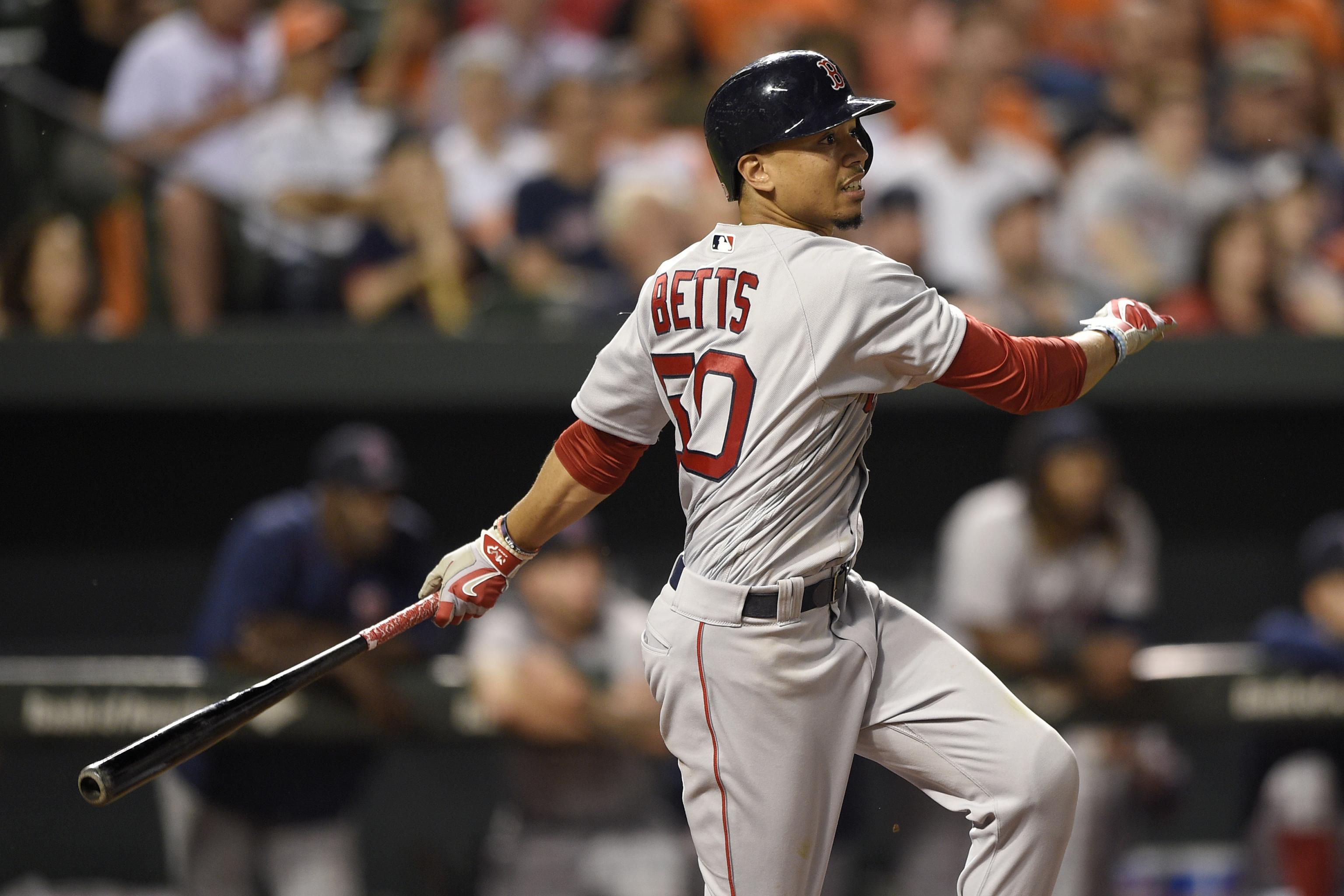 Former Red Sox star Mookie Betts cheered in return to Boston