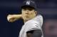 New York Yankees starting pitcher Masahiro Tanaka, of Japan, goes into his windup against the Tampa Bay Rays during the first inning of a baseball game Friday, May 27, 2016, in St. Petersburg, Fla. (AP Photo/Chris O'Meara)