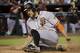 San Francisco Giants' Hunter Pence scores on an RBI-double by teammate Brandon Crawford during the ninth inning of a baseball game against the Arizona Diamondbacks, Sunday, May 15, 2016, in Phoenix. (AP Photo/Matt York)