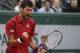 Serbia's Novak Djokovic clenches his fist as he plays Austria's Dominic Thiem during their semifinal match of the French Open tennis tournament at the Roland Garros stadium, Friday, June 3, 2016 in Paris. (AP Photo/Michel Euler)
