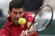 Serbia's Novak Djokovic returns the ball to Austria's Dominic Thiem during their semifinal match of the French Open tennis tournament at the Roland Garros stadium, Friday, June 3, 2016 in Paris. (AP Photo/Michel Euler)