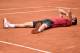 Serbia's Novak Djokovic celebrates after winning the men's final match against Britain's Andy Murray at the Roland Garros 2016 French Tennis Open in Paris on June 5, 2016. / AFP / PHILIPPE LOPEZ (Photo credit should read PHILIPPE LOPEZ/AFP/Getty Images)