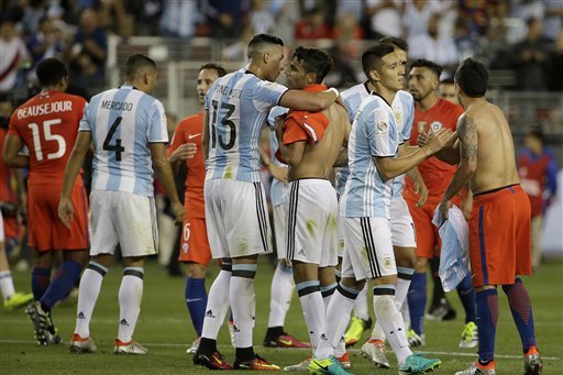 Argentina players, in blue, greet players from Chile after a Copa America Centenario Group A soccer match at Levi's Stadium in Santa Clara, Calif., Monday June 6, 2016. Argentina won 2-1. (AP Photo/Jeff Chiu)
